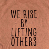 We Rise by Lifting Others T-Shirt - Heather Prism Sunset - Sporting Up